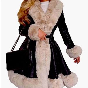 Beautiful black with cream faux fur coat. Size small.